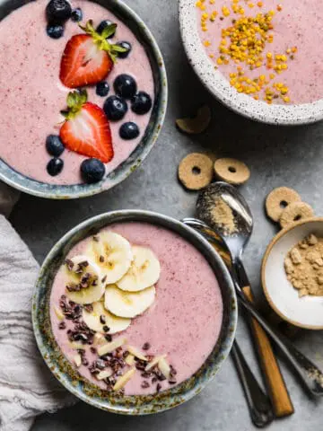 pink smoothie bowls topped off with fresh fruit