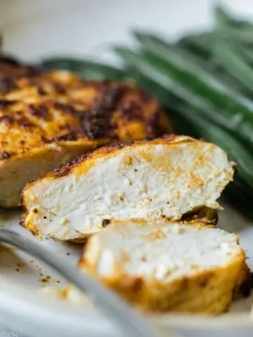 cut open and inside of an air fryer chicken breast on a plate