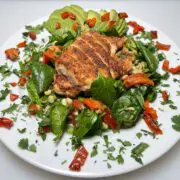 Southwest spinach salad with sauteed chicken & roasted bell peppers