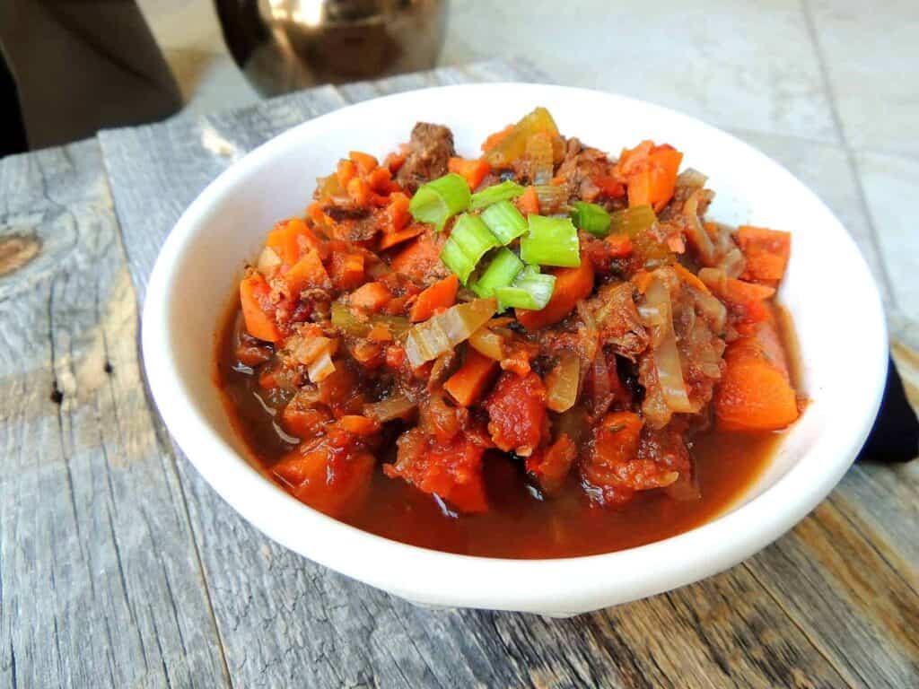 Healthy, Hearty Buffalo Stew on a wooden table