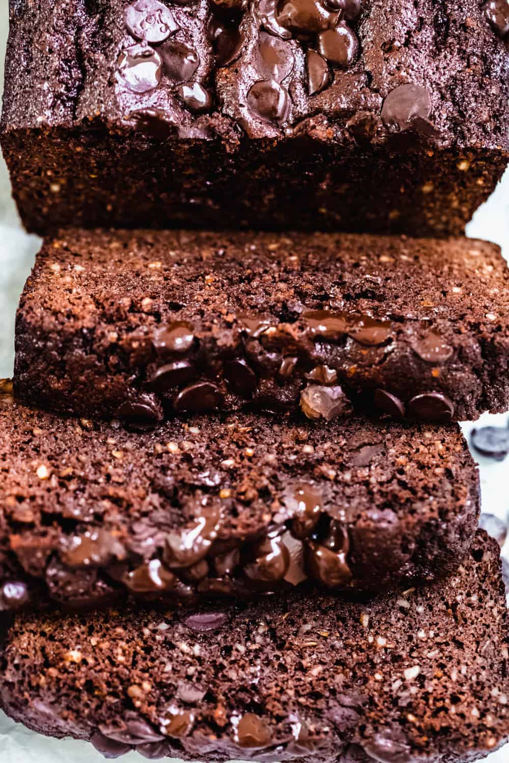 close up of slices of zucchini bread with cacao and chocolate chips