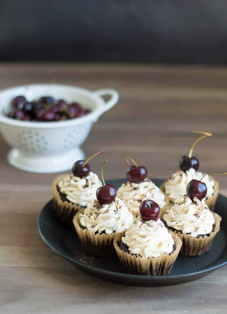 black forest cupcakes on a black plate