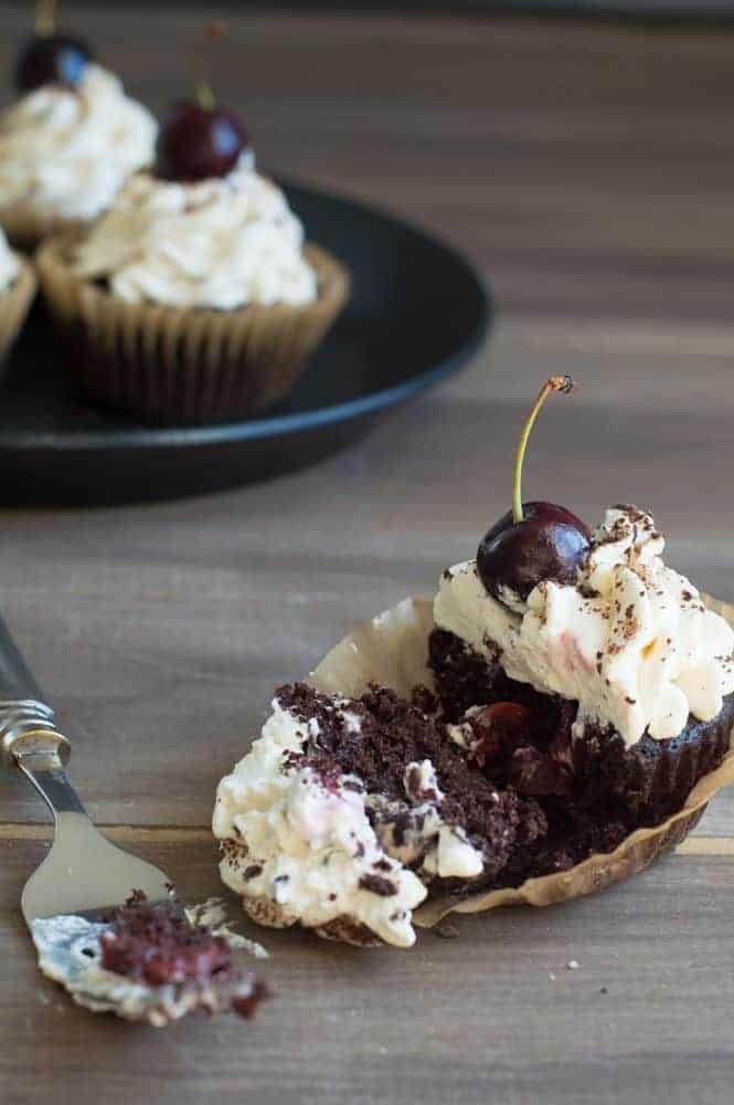 black forest cupcake half eaten with a fork