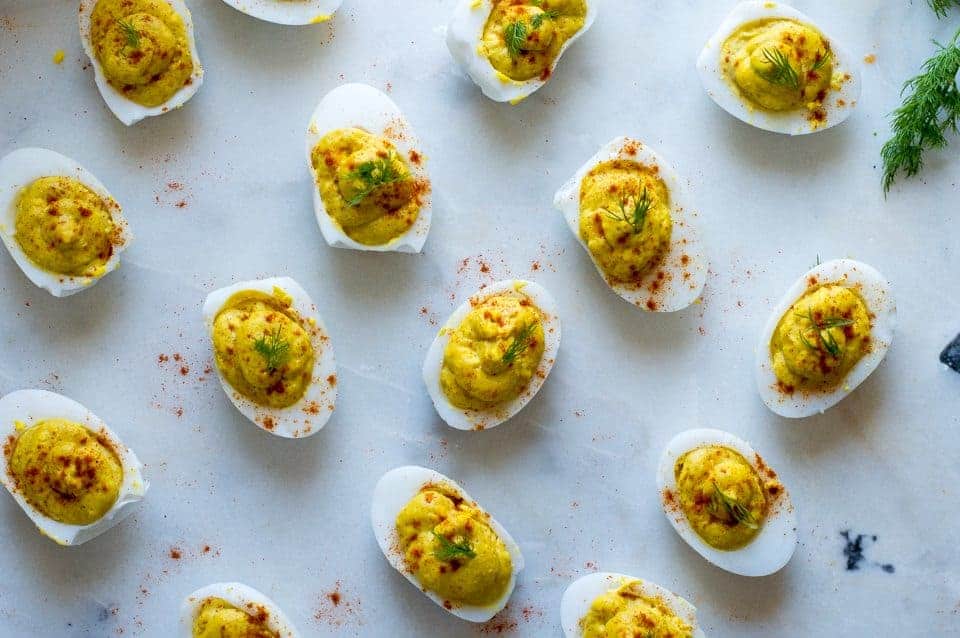 Lots of Deviled Duck Eggs on a white counter