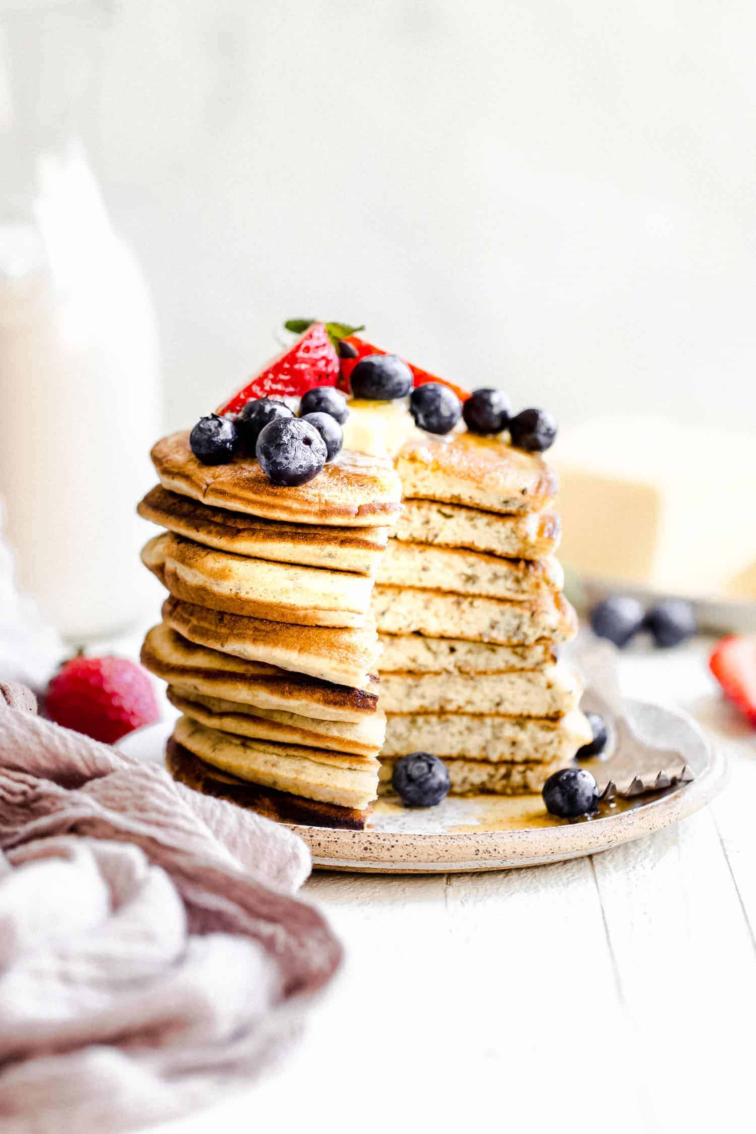 stack of paleo pancakes with berries on top