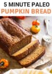 pumpkin bread slices on parchment paper with a serving spatula on the side