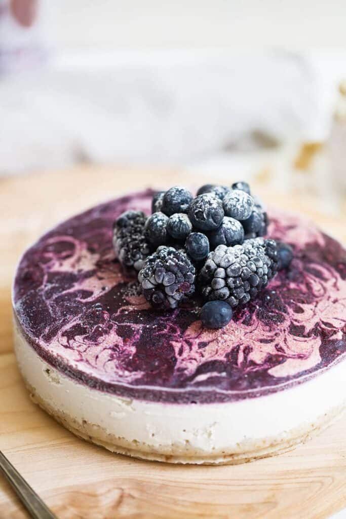 Easy Vegan Blueberry Cheesecake that is easy to make and is so silky, smooth and delicious with fresh blueberries and a creamy cashew center. Gluten free, vegan blueberry cheesecake that’s freezer friendly and so easy to make! Paleo blueberry cheesecake. Raw vegan blueberry cheesecake recipe. Raw paleo cheesecake recipe. No bake cashew cheesecake. Best gluten free vegan cheesecake. No bake blueberry cheesecake recipe. Healthy vegan desserts right here.