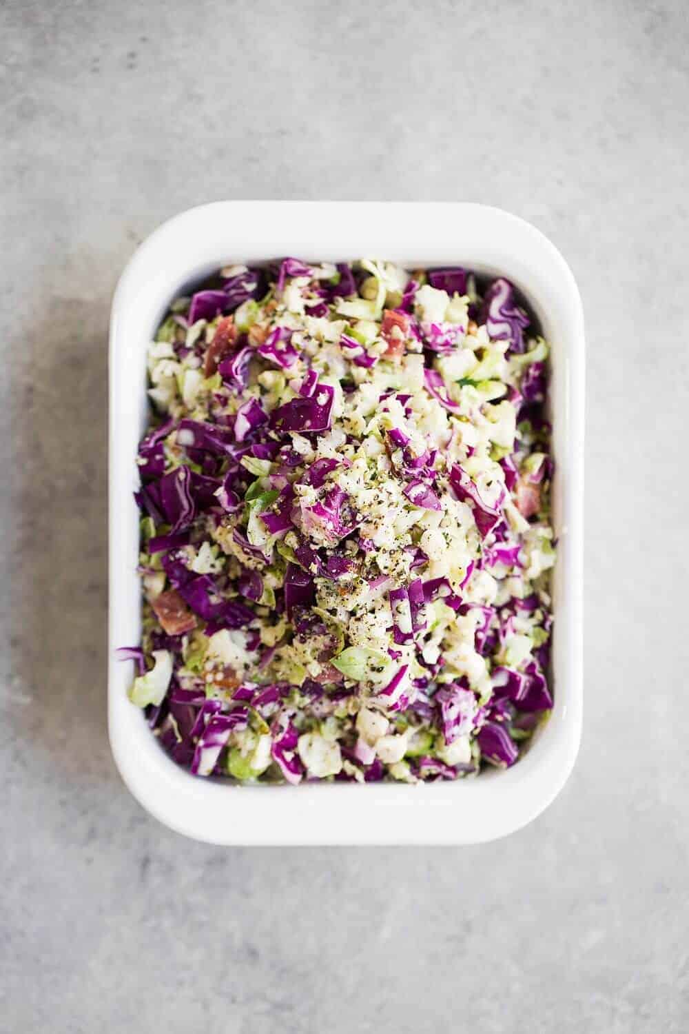 Paleo Brussels Sprout Slaw in a white side dish