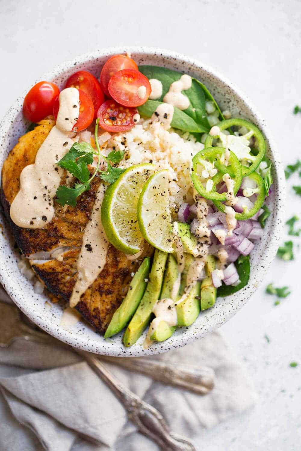 This recipe for Paleo Fish Taco Bowls will leave you wanting more! Healthy whole30 fish taco bowl that is served on a bed of lettuce and cauliflower rice, topped off with a creamy chipotle sauce! Only 10 minutes to prepare! whole30 meal plan. Easy whole30 dinner recipes. Whole30 recipes. Whole30 lunch. Whole30 meal planning. Whole30 meal prep. Healthy paleo meals. Healthy Whole30 recipes. Easy Whole30 recipes. Easy whole30 dinner recipes...