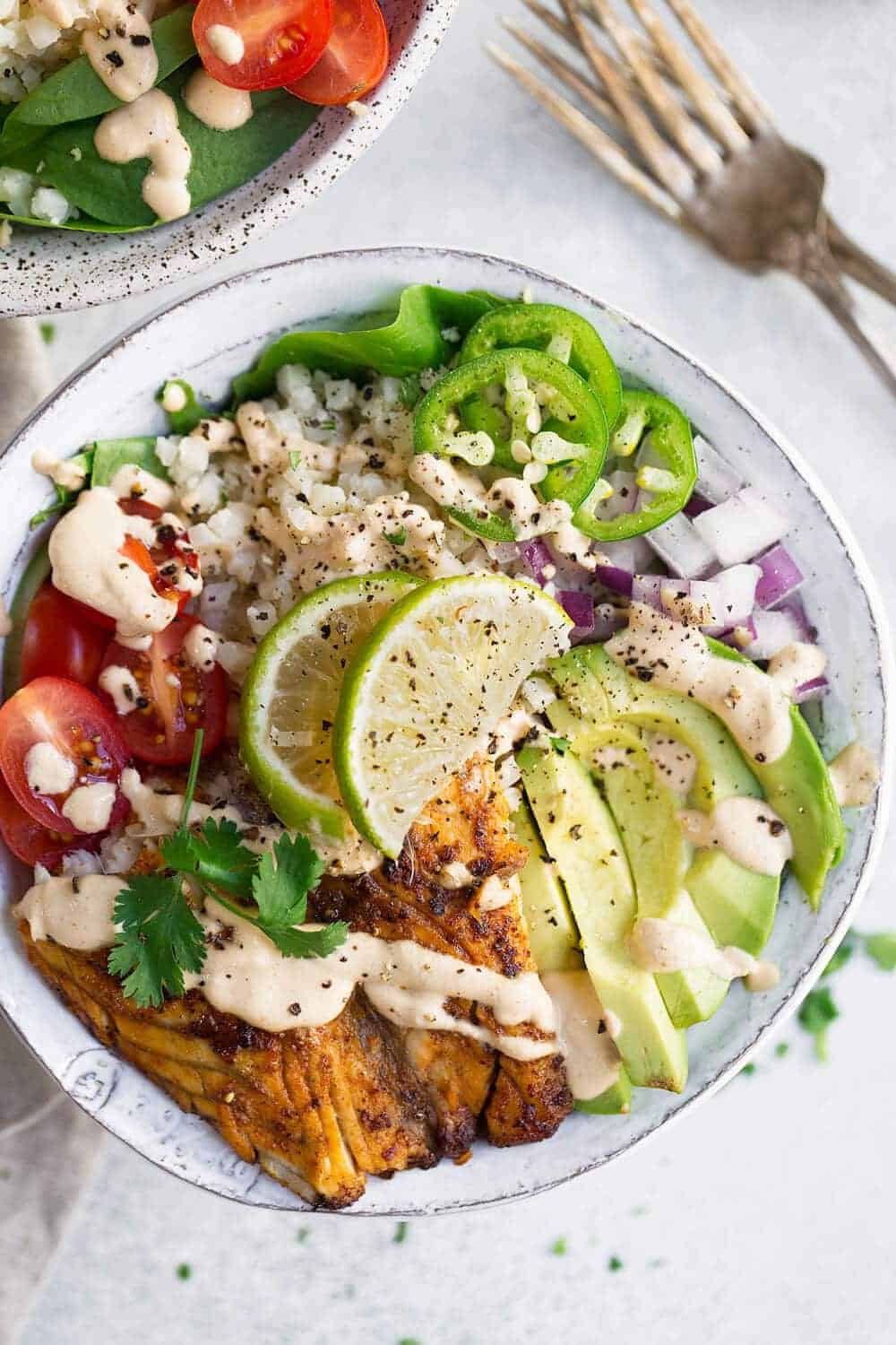 Fish taco bowl drizzled with dressing