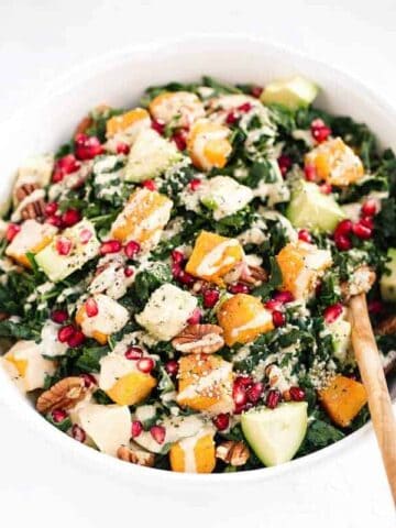 Roasted Butternut Salad with kale, avocado, pecans & pomegranate. A healthy, gluten free recipe filled with fall flavors. Easy, filling and perfect for make ahead lunches and dinners! Recipe at themovementmenu.com