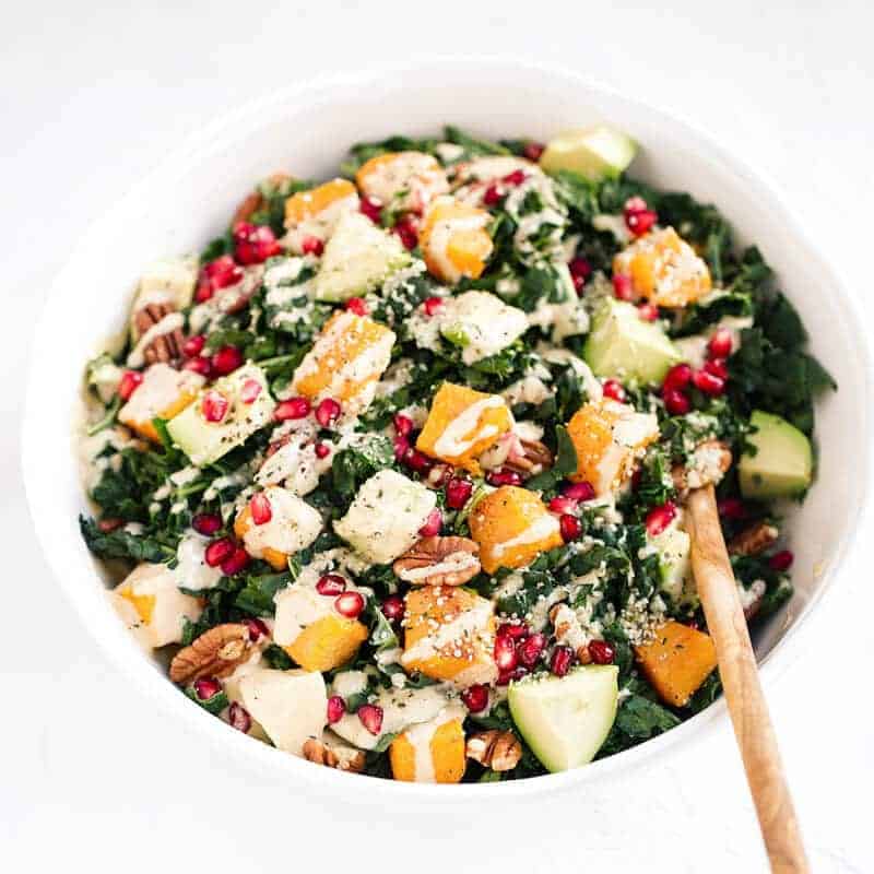 Roasted Butternut Salad with kale, avocado, pecans & pomegranate. A healthy, gluten free recipe filled with fall flavors. Easy, filling and perfect for make ahead lunches and dinners! Recipe at themovementmenu.com