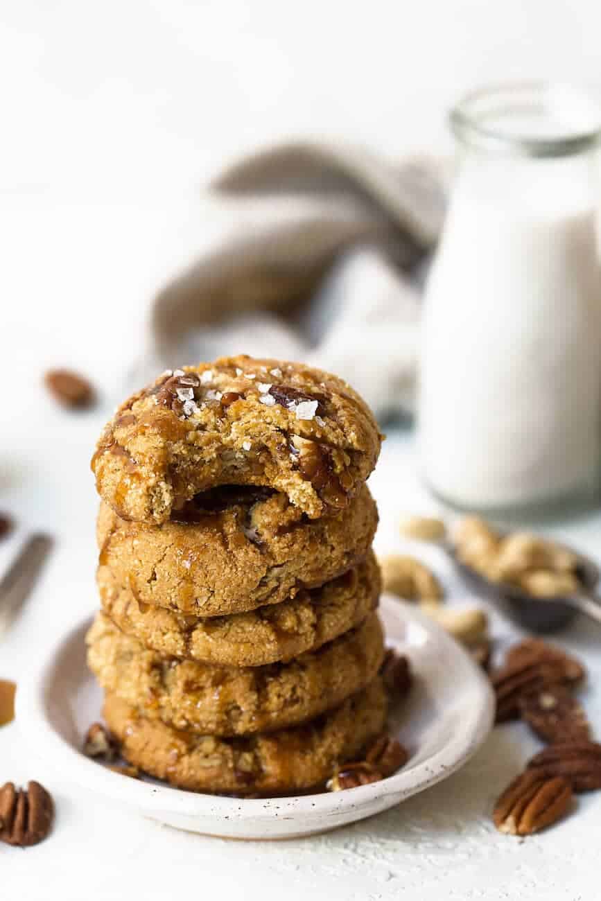 Salted Caramel Pecan Cookies stacked in a pile of five
