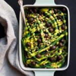 A perfect side dish for your Thanskgiving table or really any time of the year are these green beans with dairy free pumpkin alfredo and olives. Paleo thanksgiving recipes.