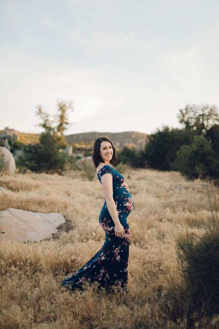 Smiling pregnant woman outside 