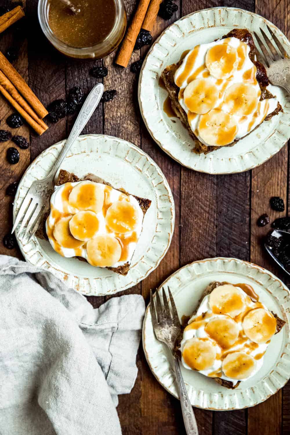 french toast topped with banana and coconut whipped cream