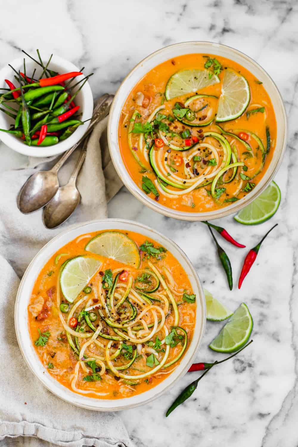 two bowls of chicken zucchini noodle soup