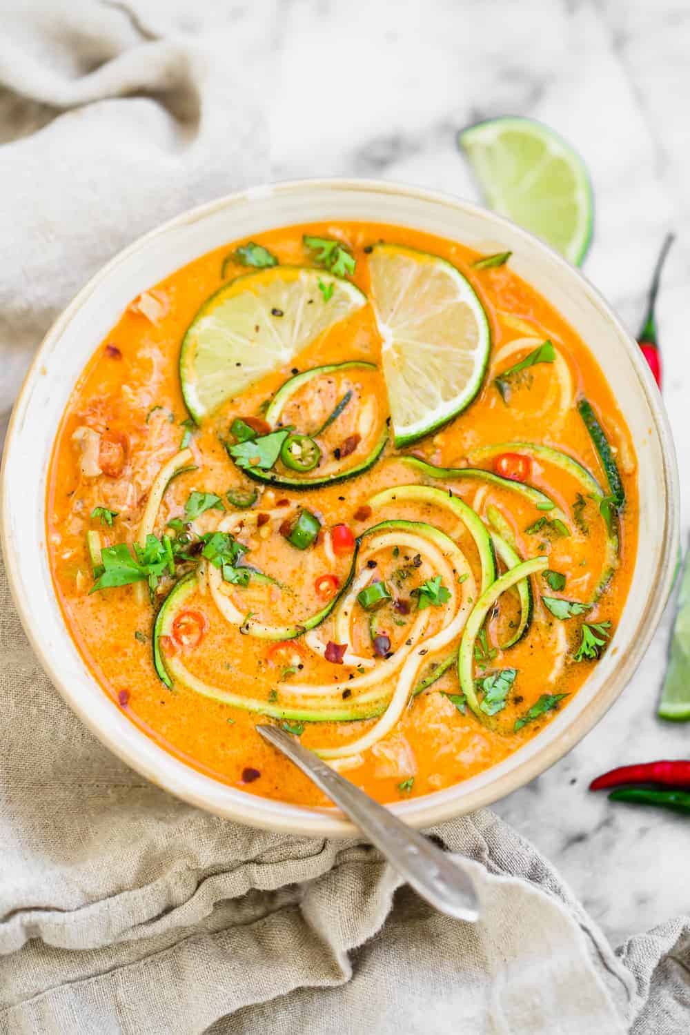 close up of a bowl of Thai chicken zucchini noodle soup