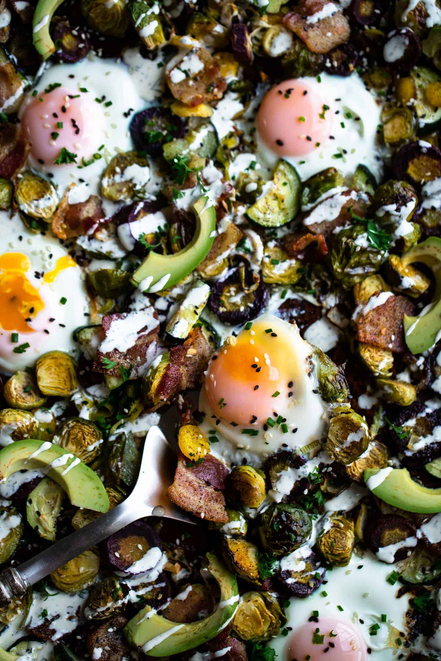 a paleo one pan breakfast on a sheet pan with eggs, avocado and vegetables!