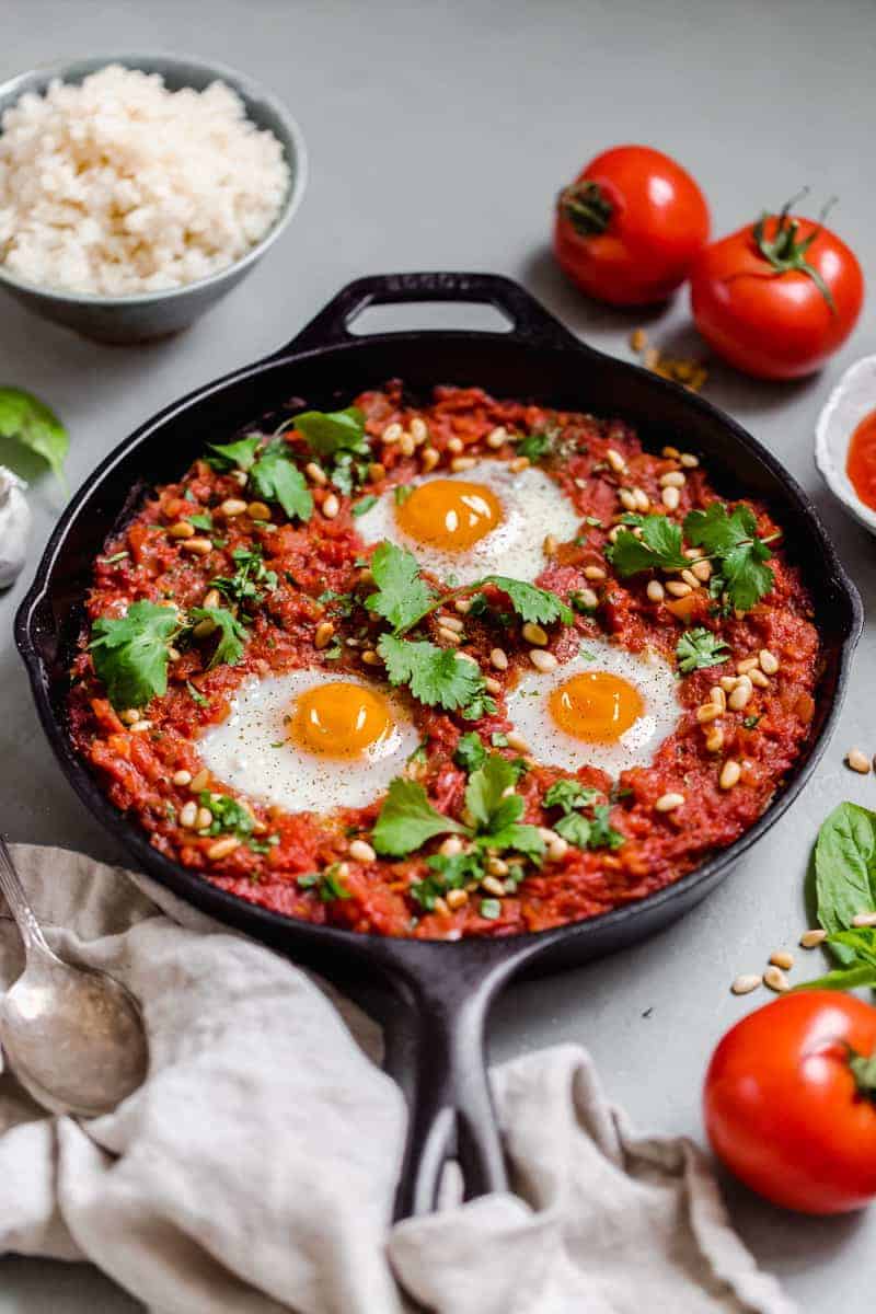 Whole30 Shakshuka with Cauliflower Rice in a cast iron pan