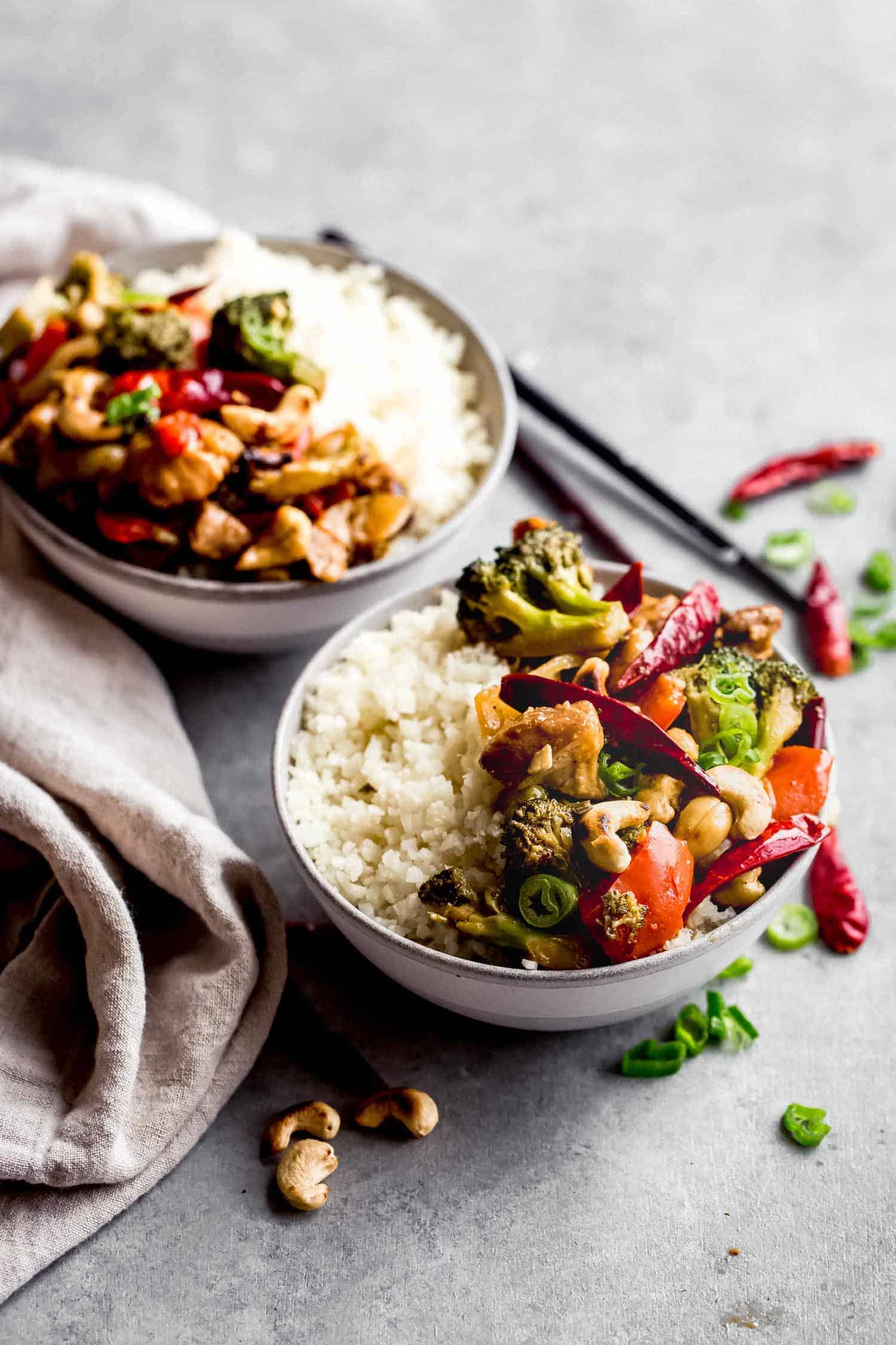Chicken, cashews, vegetables and rice in two bowls