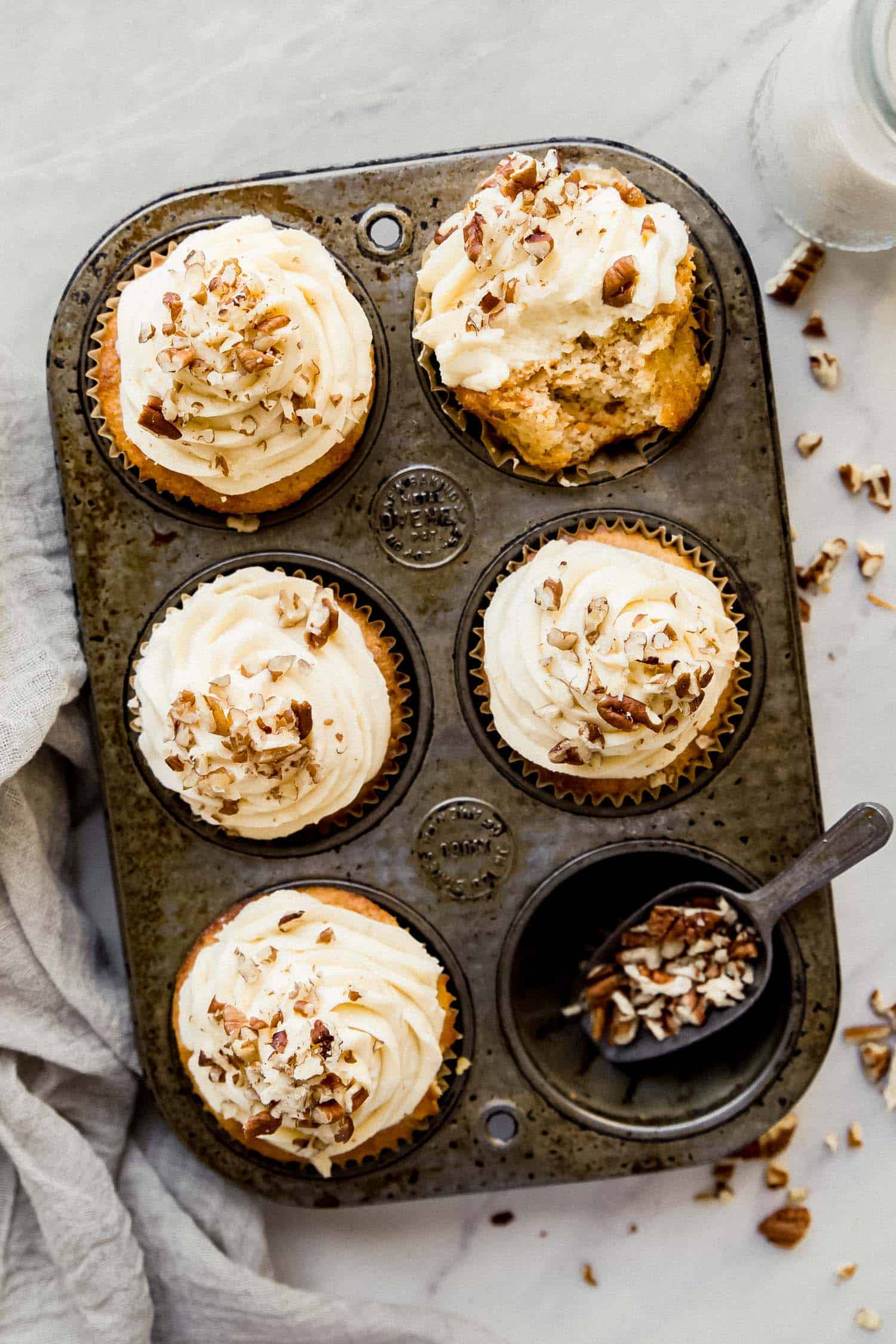 carrot cake cupcakes in an antique muffin tin