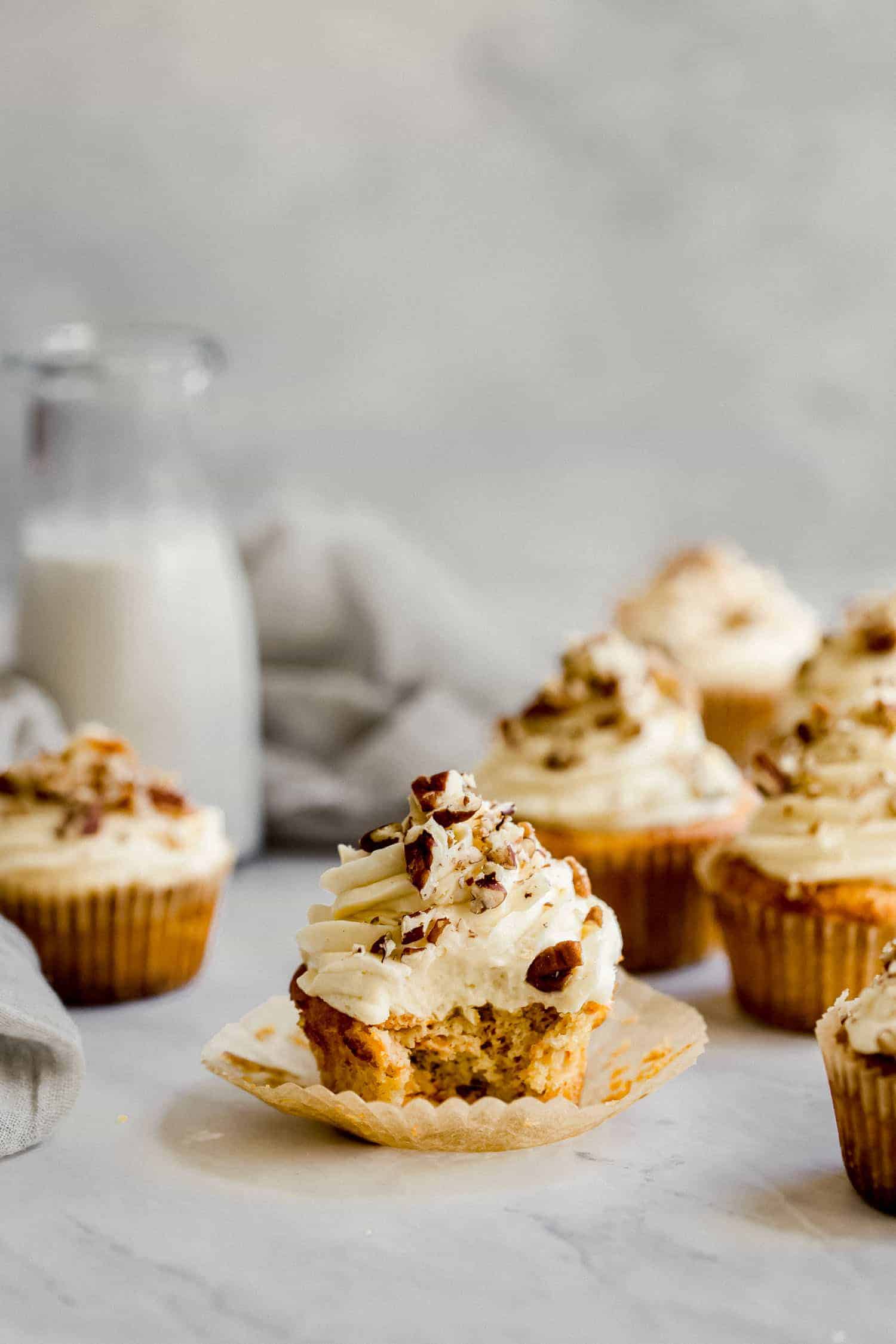 carrot cake cupcakes with a bite taken out