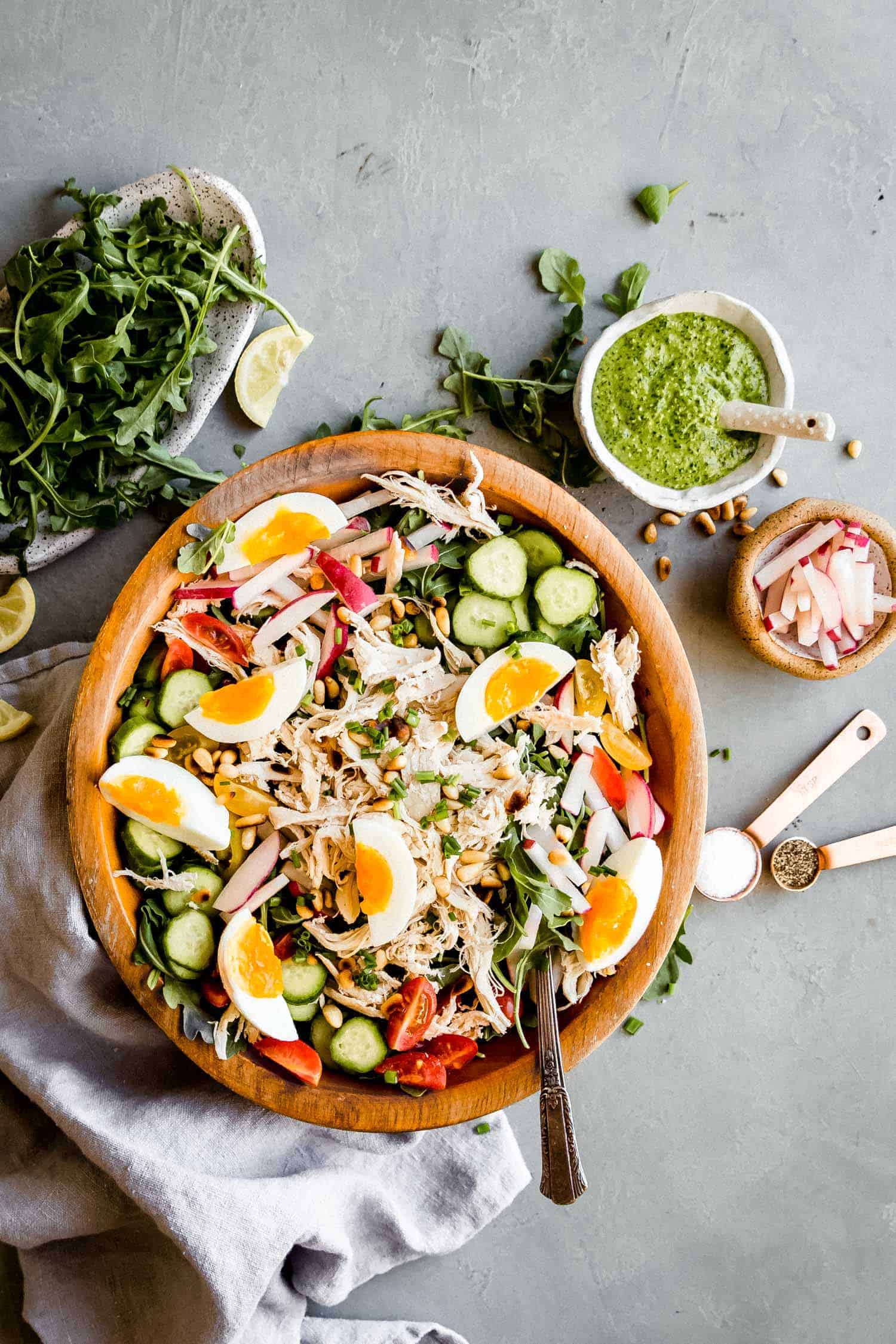 paleo pesto chicken salad in a wooden bowl