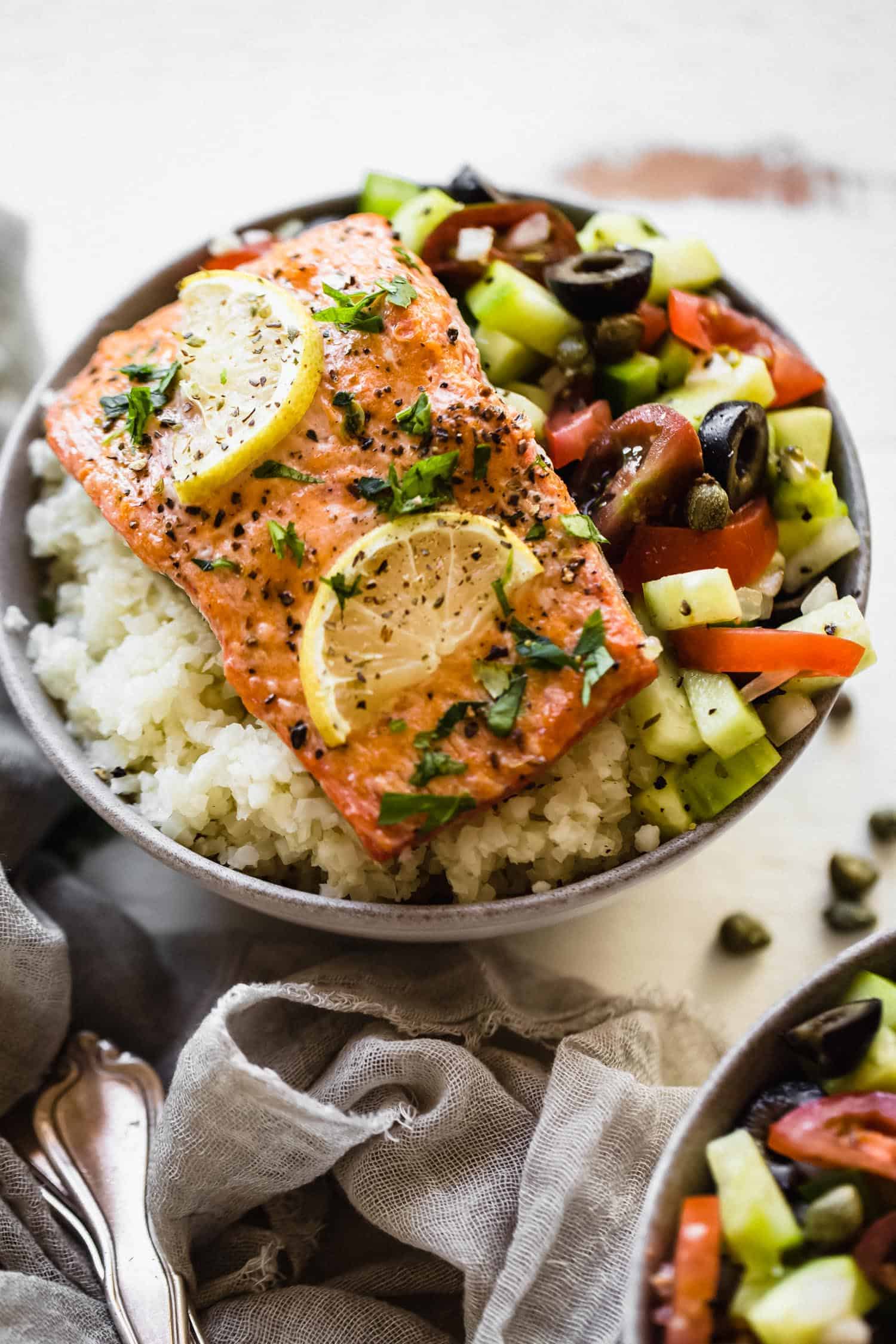 Whole30 Greek salmon in a bowl with cauliflower rice and salad