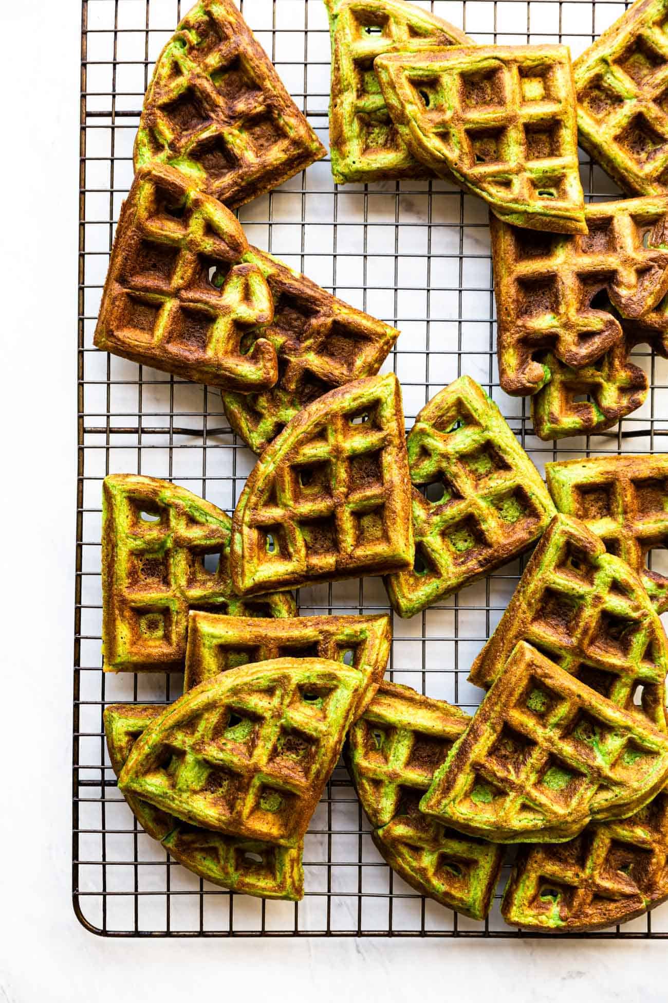 bone broth waffles with spinach cut on a metal wire rack