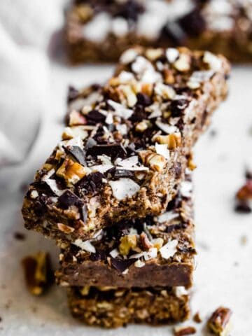 close up of 3 pecan low carb protein bars with chocolate
