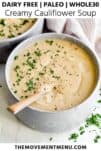 creamy cauliflower soup in a bowl with a spoon and fresh parsley