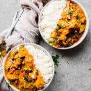 two bowls of vegan Thai curry with a linen napkin