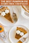 two slices of paleo pumpkin pie on white plates with whipped cream