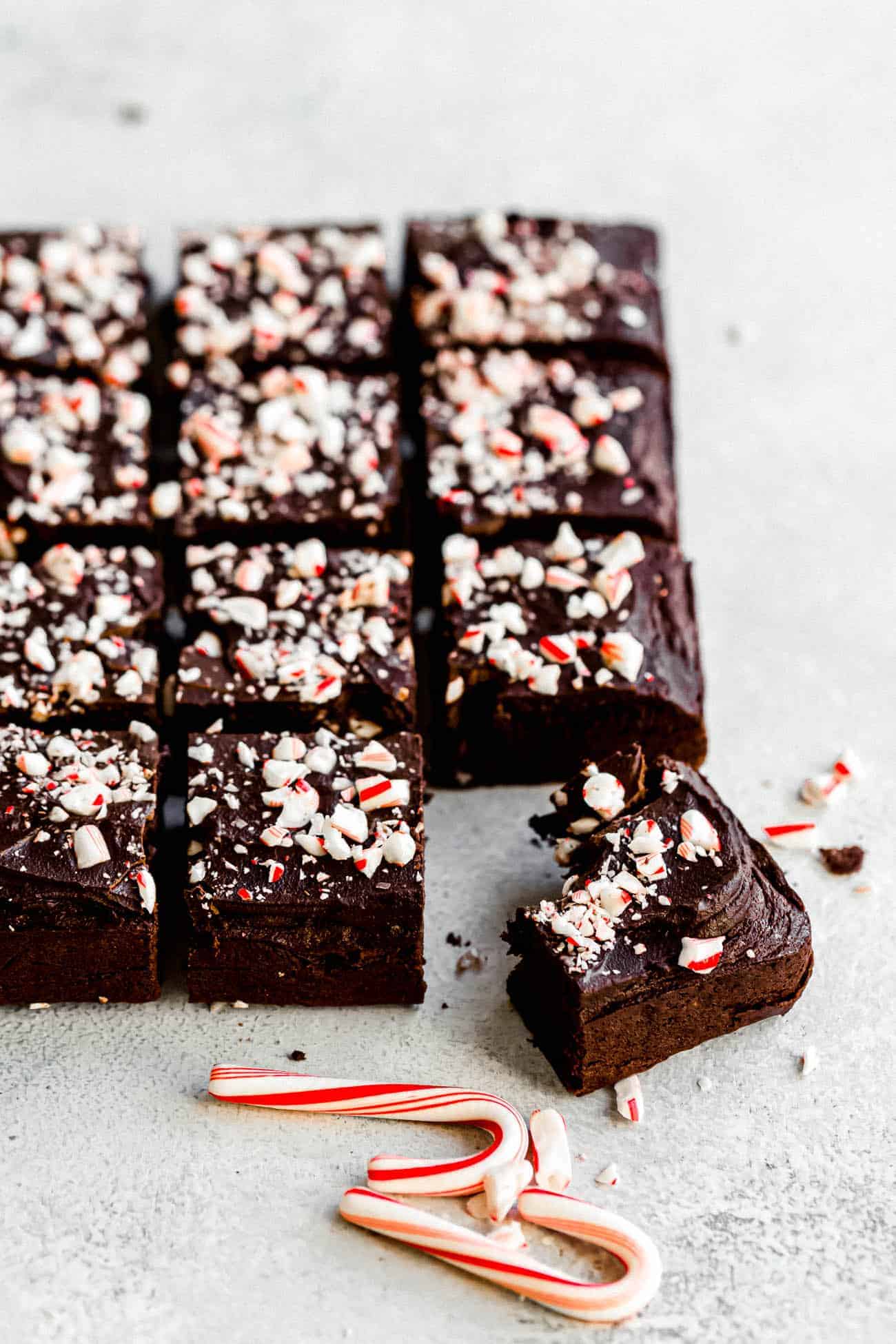 peppermint fourless brownies with candy canes on top and on the side