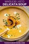 delicata squash soup in a white bowl with a spoon inside