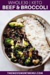 beef and broccoli in a bowl with white rice and a fork with