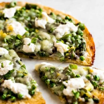 low carb pizza made with asparagus, peas, and burrata cheese