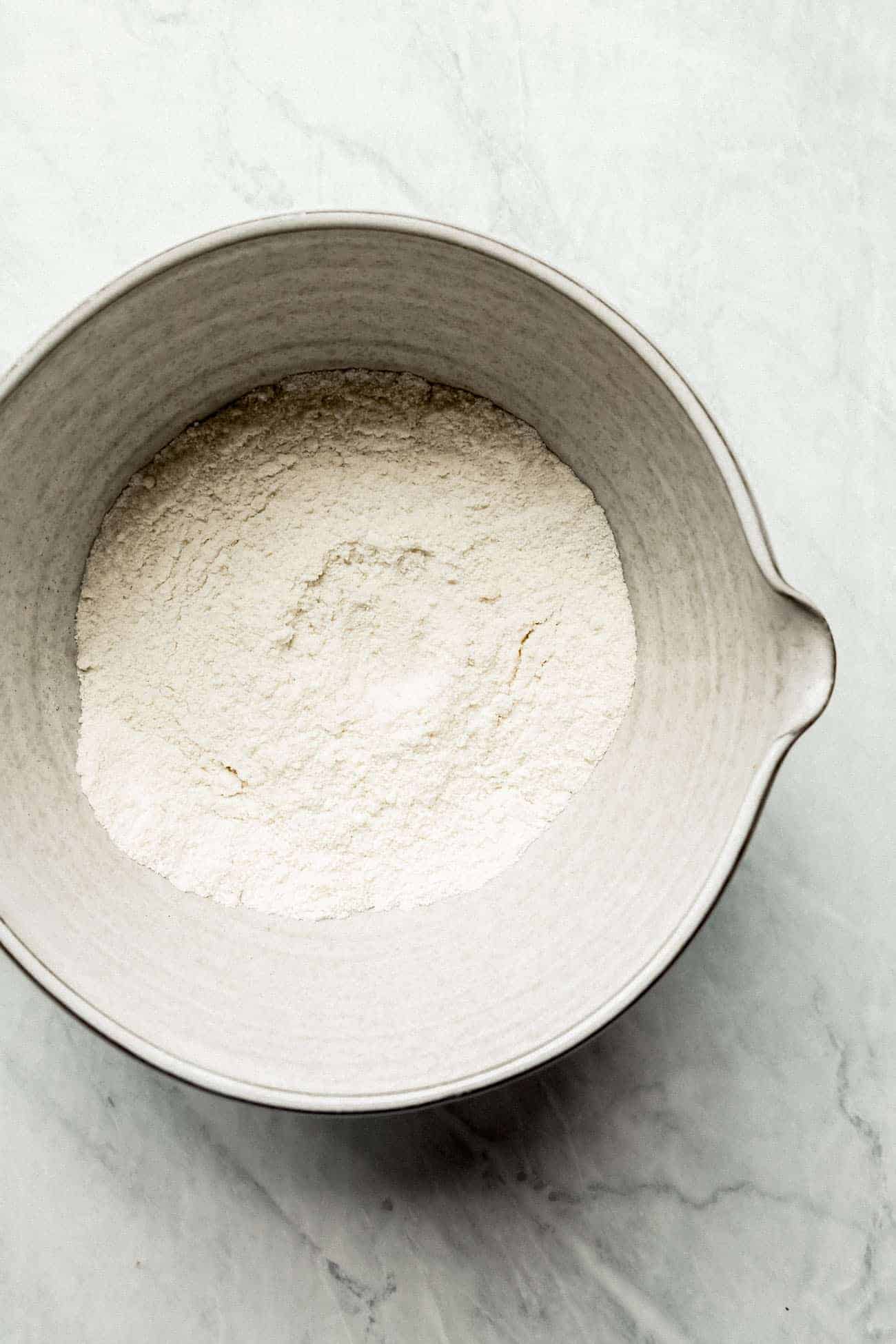 blend of dry ingredients and flours in a white ceramic bowl