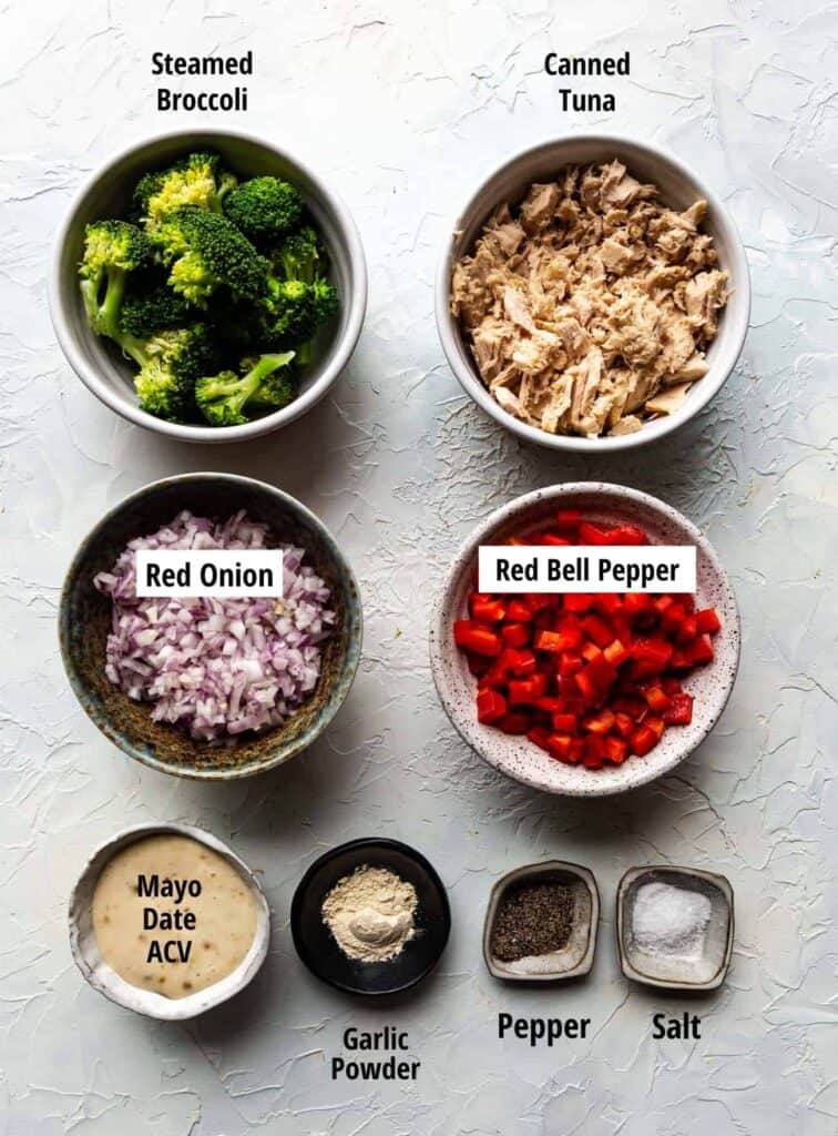 ingredients for paleo tuna salad: Steamed Broccoli, Canned Tuna, Red Onion, Red Bell Pepper, Mayo, Date, ACV, Garlic Powder, Pepper, Salt