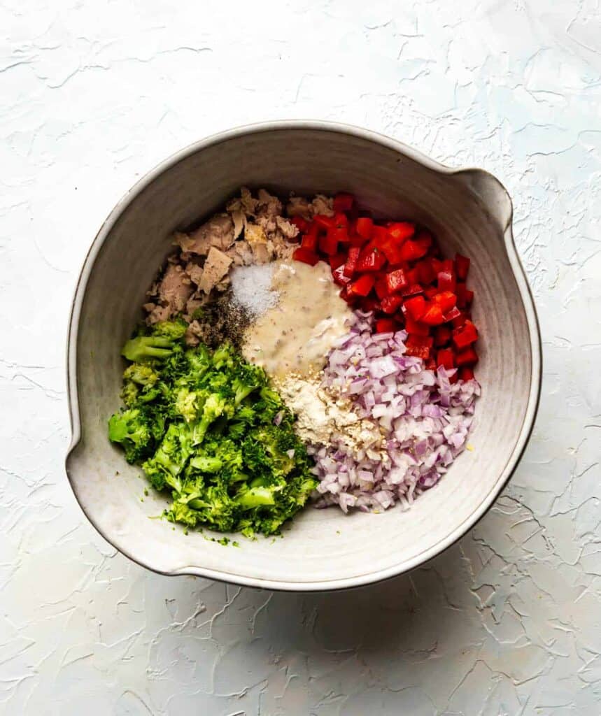 ingredients for tuna salad in a ceramic bowl