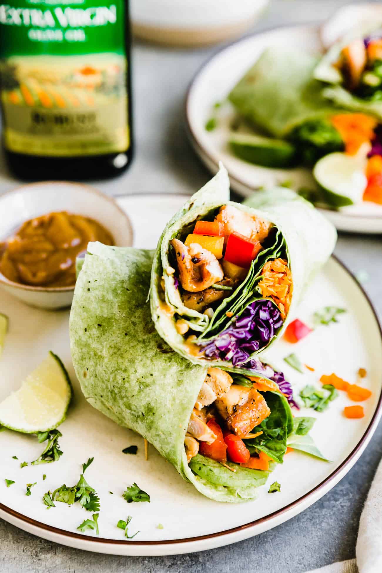 gluten free Thai chicken wraps with sauce on the side on a plate
