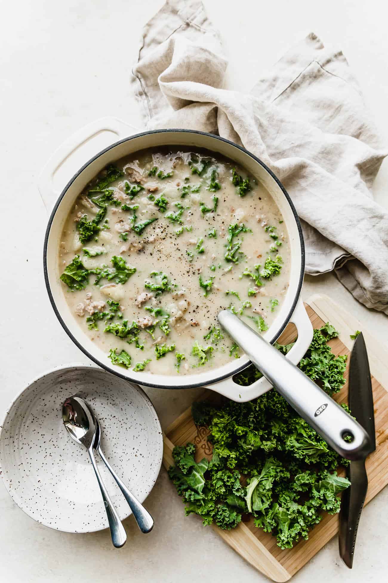 Zuppa Toscana in an Instant Pot with a ladle inside