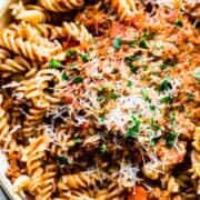 close up of bolognese sauce with gluten free pasta and cheese