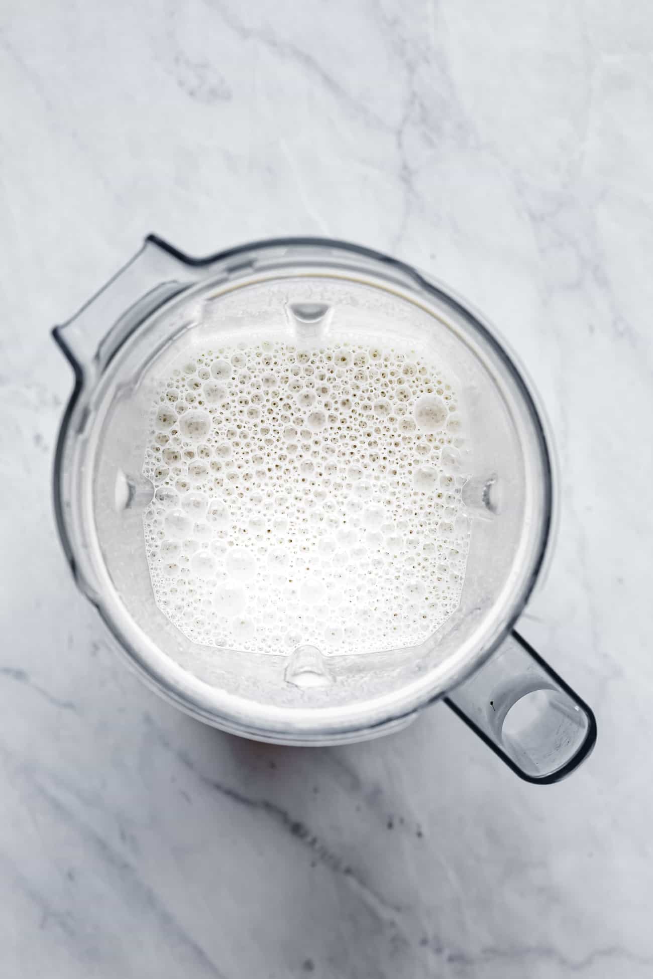 blender pitcher with cashew coffee creamer inside