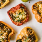stuffed peppers with cheese and cilantro on a board