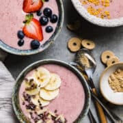 pink smoothie bowls topped off with fresh fruit