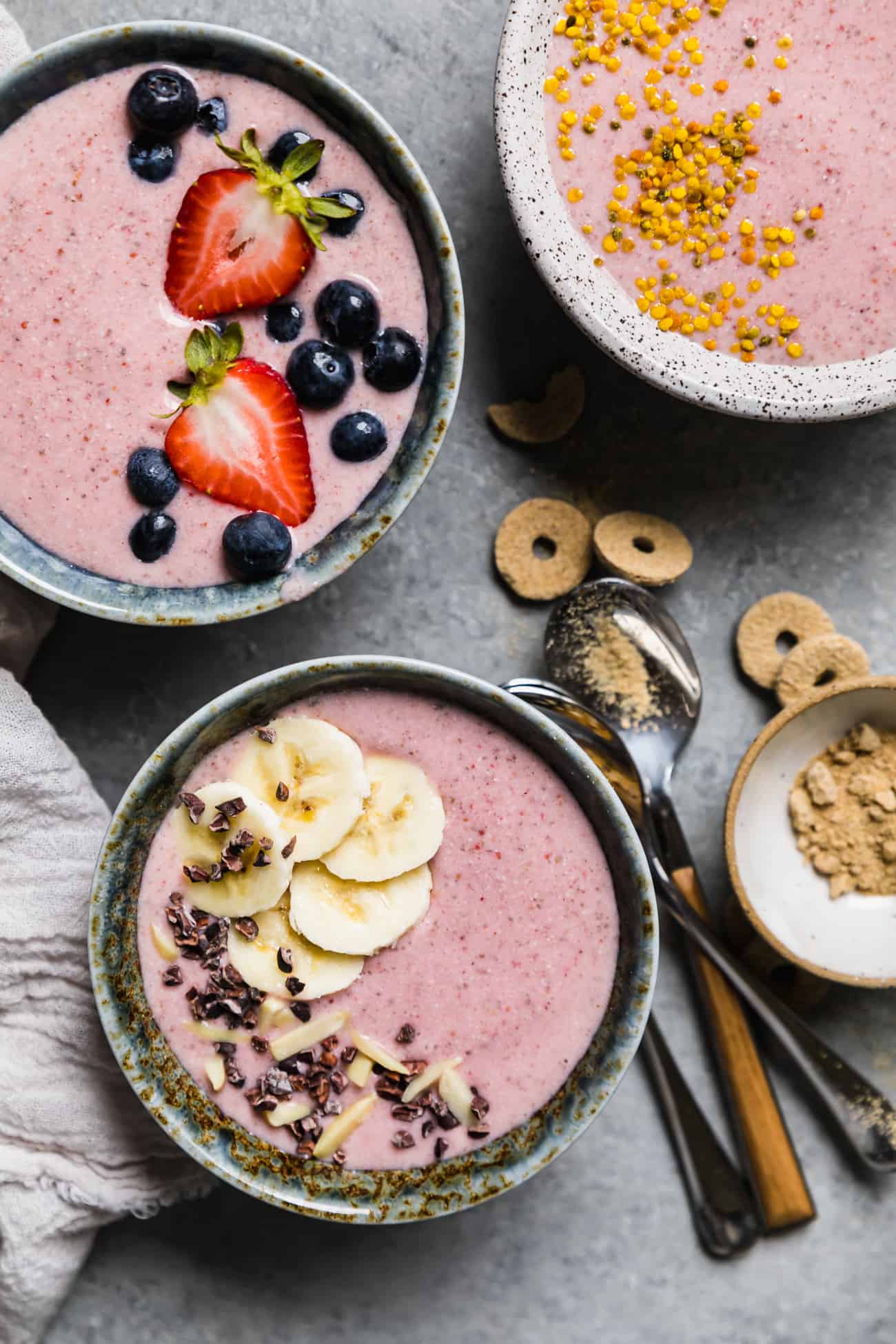pink smoothie bowls topped off with fresh fruit