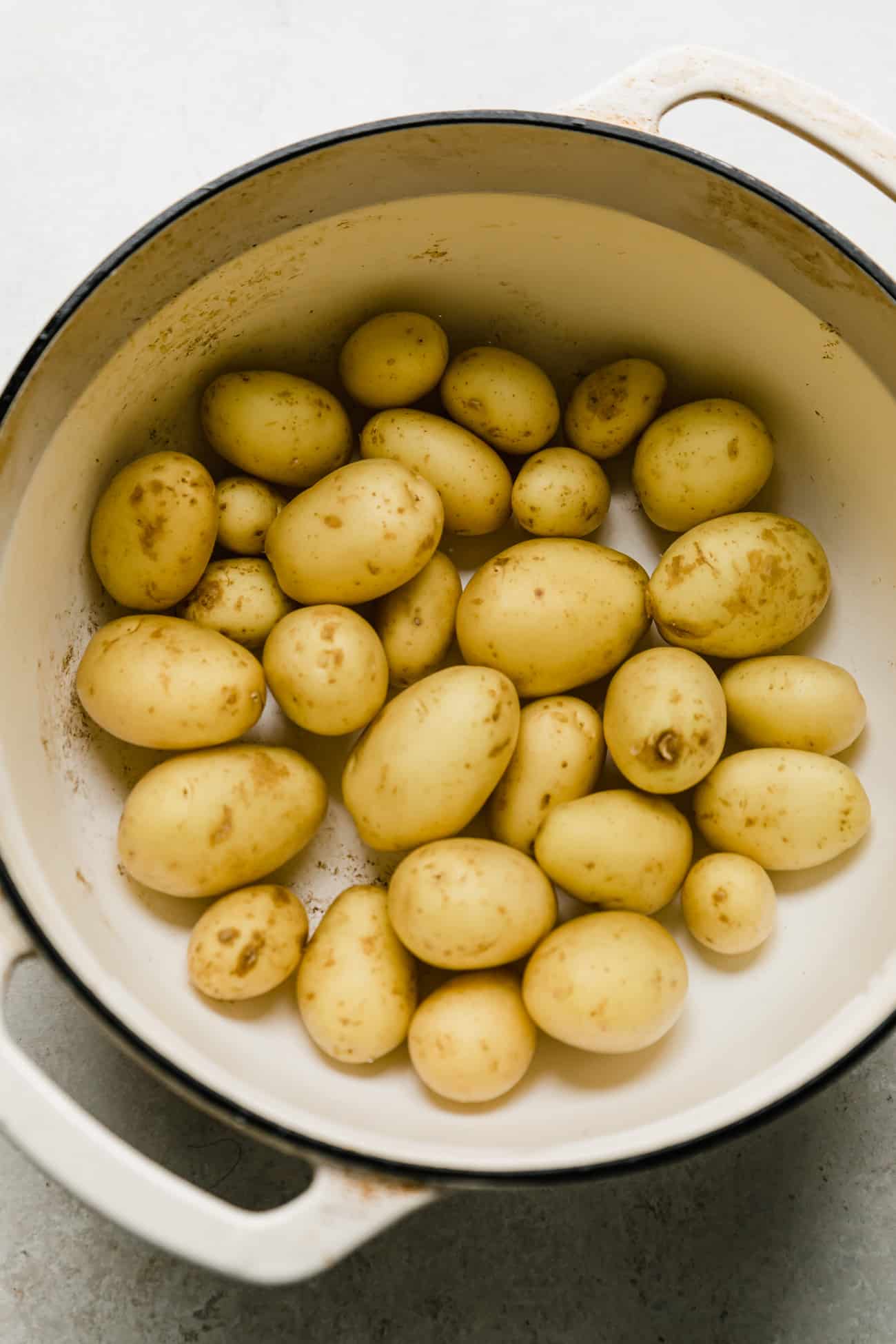 baby yukon gold potatoes in a white ceramic pot 