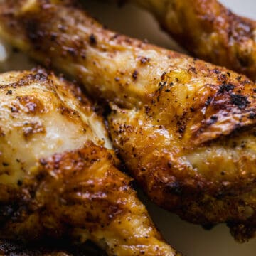 air fryer drumsticks together on a white plate